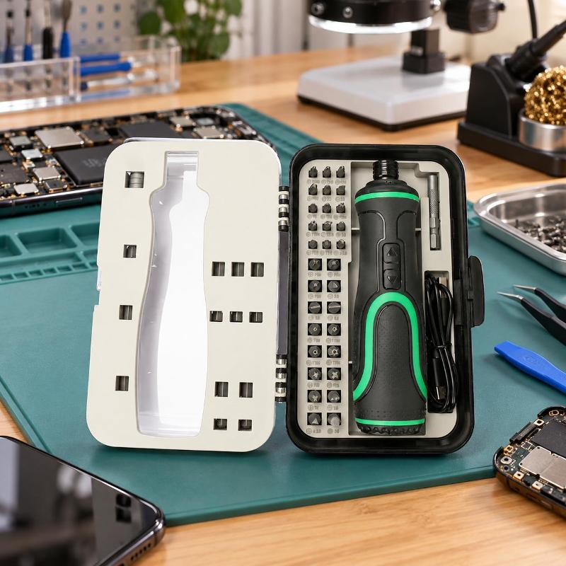 41-in-1 Electric Screwdriver Kit with Multiple Bit Options Top-down view of an open 41-in-1 electric screwdriver kit. The case is black with a white interior tray holding various magnetic bits. The central electric screwdriver handle is black with green accents, featuring forward/reverse buttons and a sleek, ergonomic design.